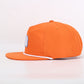 Orange cap with a logo on a light pink background