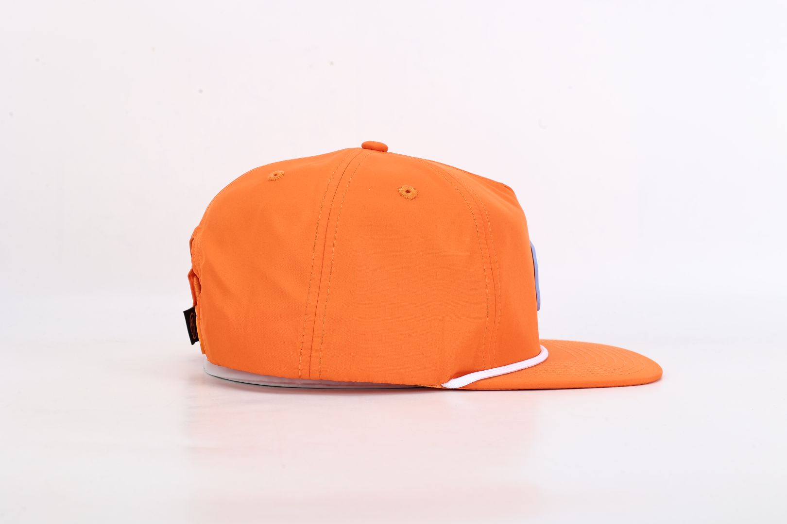 Orange cap with a white logo on a light gray background