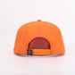 Orange cap with a visible brand logo on a white background