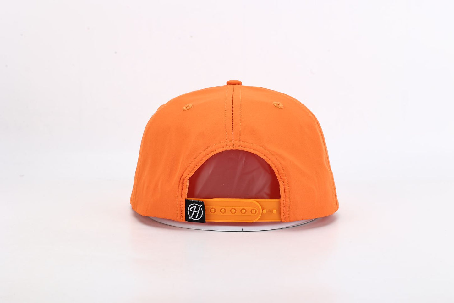 Orange cap with a visible brand logo on a white background
