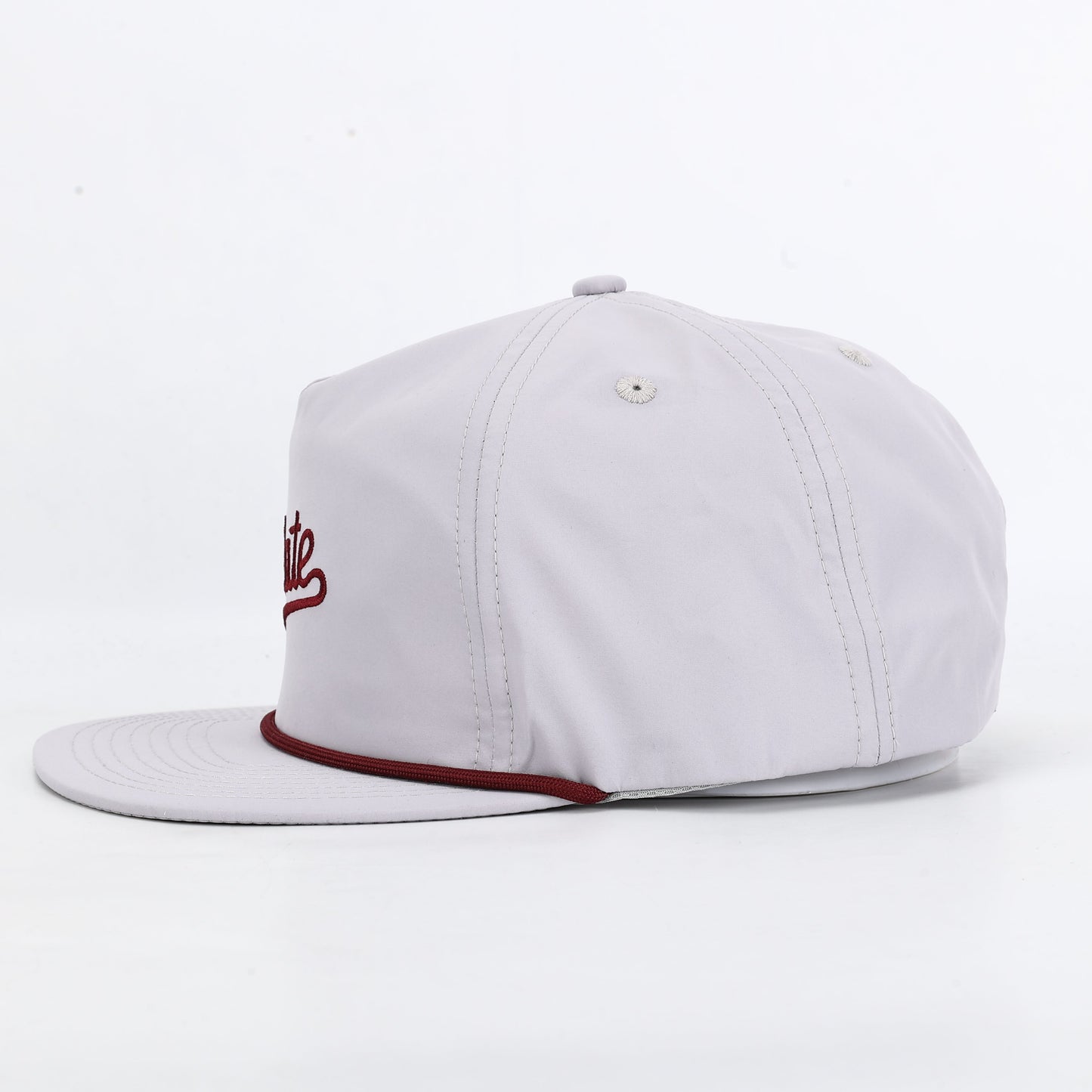 White cap with red brim and logo on a white background