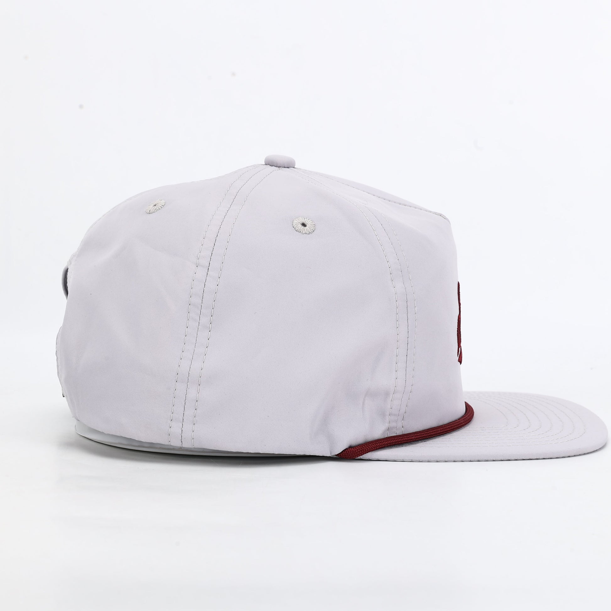 White cap with red interior on a white background