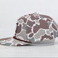 Camouflage-patterned cap on a light gray background