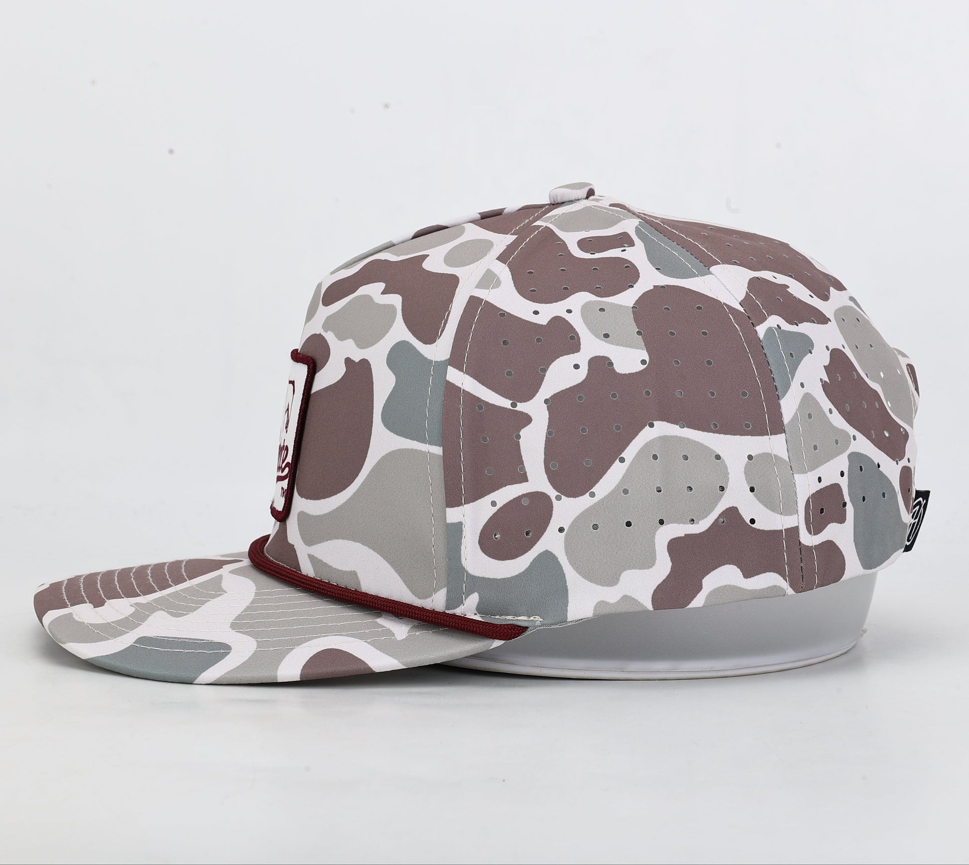 Camouflage-patterned cap on a light gray background