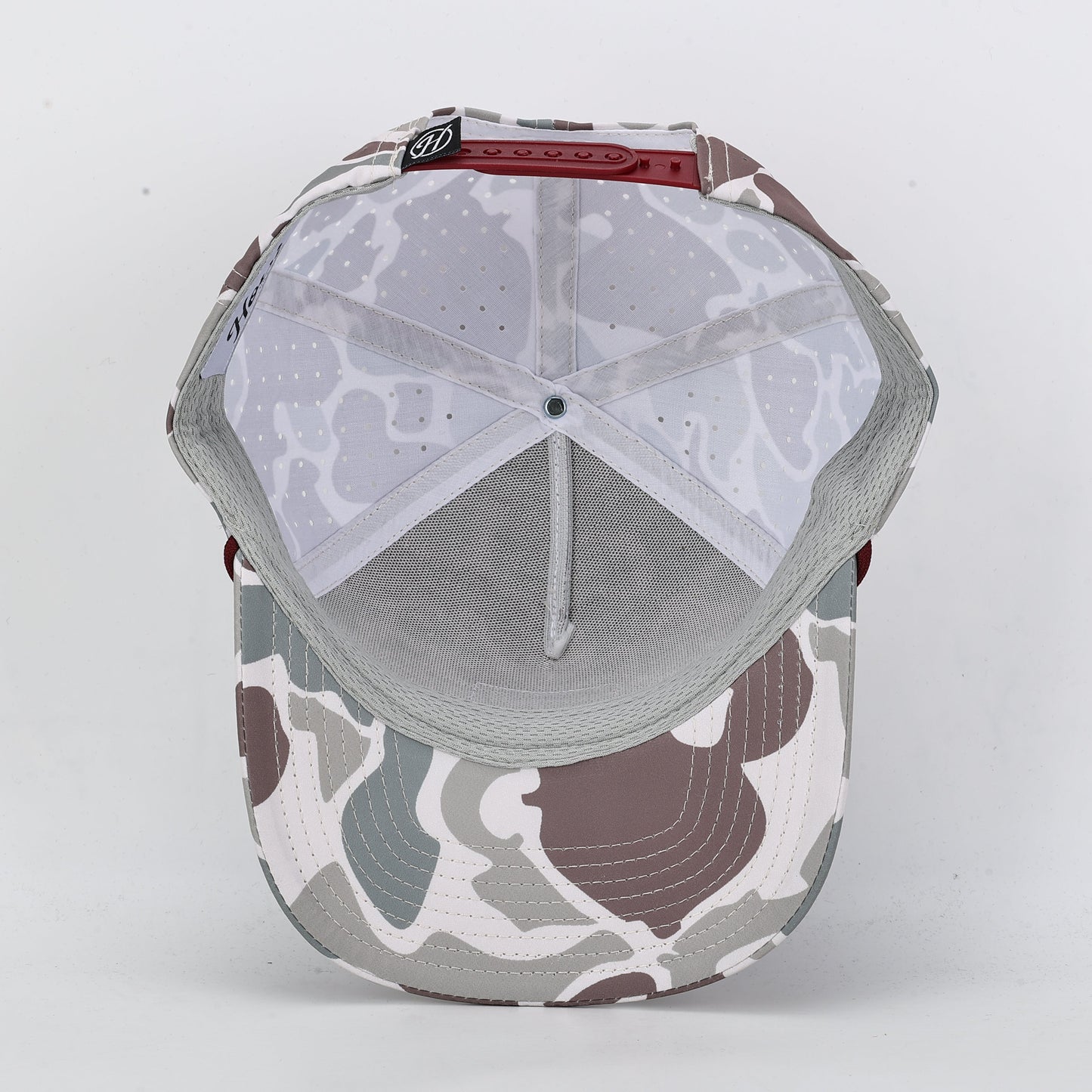 Camouflage-patterned baseball cap on a white background