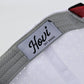 Close-up of a cap with a 'Hovi' brand label on a white background