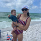 Girl wearing white Ole Miss hat 
